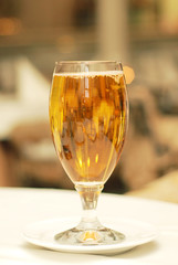 Glass of beer on table