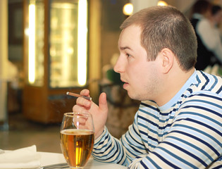 Man adult drink beer and smoke cigarette