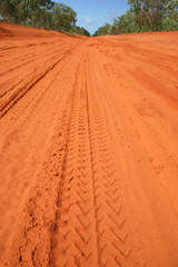 Car tracks in red dirt