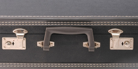 Handle and locks on a vintage suitcase