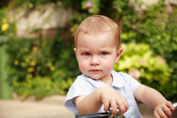 Portrait of cute kid with bike