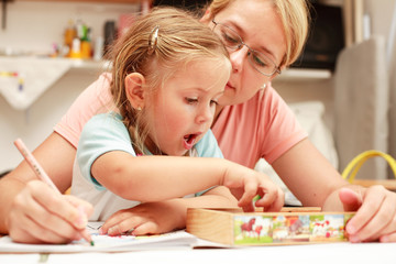 Mother and child painting together