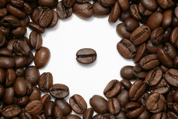 Background from ripe grains of black coffee