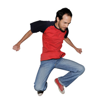 Portrait of casual young man jumping - isolated on white