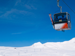 Skiers in Gondola Cablecar