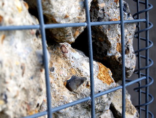 Stone wall held by wire cage
