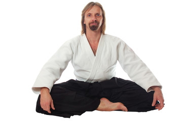 pacification teacher of aikido sit and look at camera