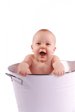 Laughing Baby in a White Tub