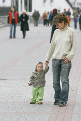 mother and son walking