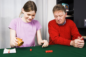 Girl and Grandpa playing dice