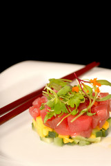 Fresh Japanese seafood, and mango appetizer with micro green sal