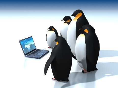 Penguins around laptop