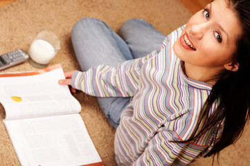 young woman is reading the magazine