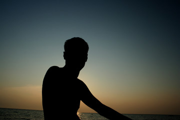Adult man on evening beach