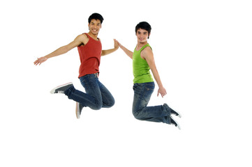 Fototapeta na wymiar Two young Asian students in jump