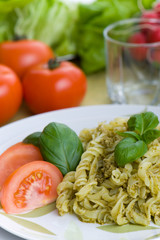 Spaghetti with pesto sauce and cheese