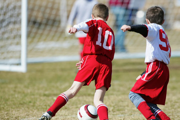 Fototapeta premium Soccer boys competing for a goal