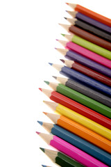 Colored pencils on white background