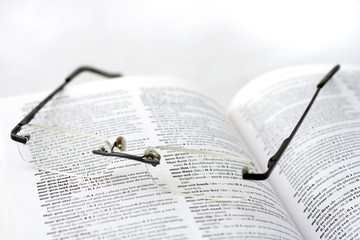 Dutch dictionary and glassses. shallow DOF. focus on Islam