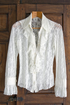 Lace blouse on antique closet