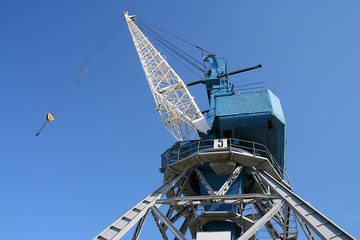 Fototapeta na wymiar Crane on blue background.