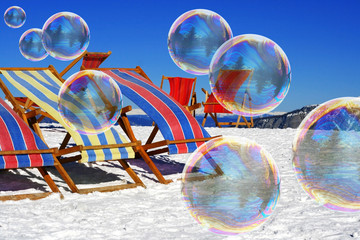 Soap bubbles on snow and deck chairs