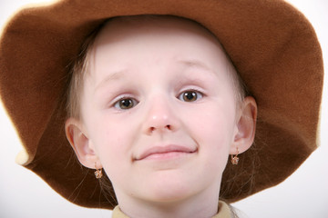 little girl in brown hat