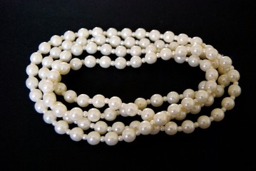 Pearl necklace on a black background
