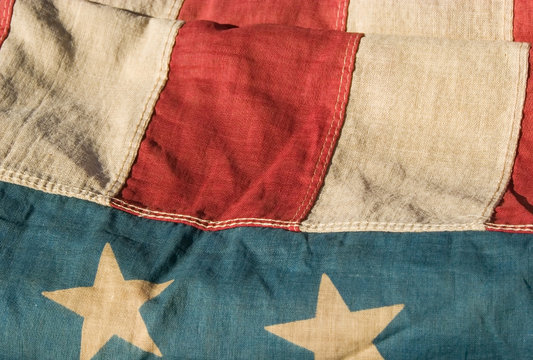 close up of a section of an antique american flag