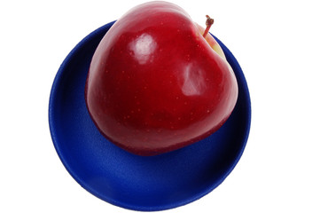juicy apple on a blue dish