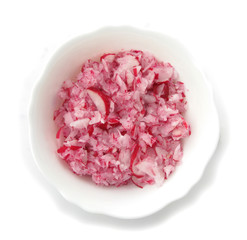 Radishes planed salad in white dish 