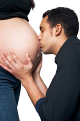 Young Man Kissing his Pregnant Wife