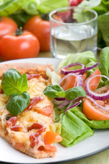 Pizza with tomato and basil