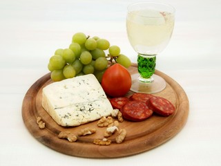 Grape, cheese with nuts and sausage