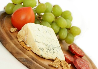 Grape, cheese with nuts and sausage