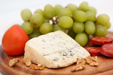 Grape, cheese with nuts and sausage