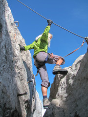 woman climbing on ferrata 2