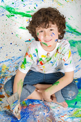 Fototapeta premium Boy playing with painting