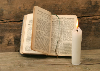 Prayer book and candle