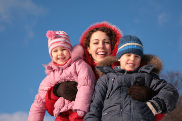 mother and children outdoor in winter