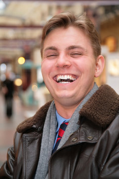 laughing man in leather jacket