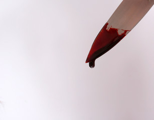 Bloody knife point © Allen Penton
