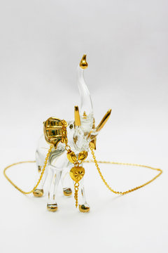 Golden Necklace on Crystal Elephant