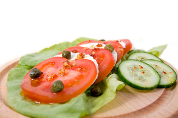 Salad with tomatos, mozarella cheese and  capers