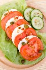 Salad with tomatos, mozarella cheese and  capers