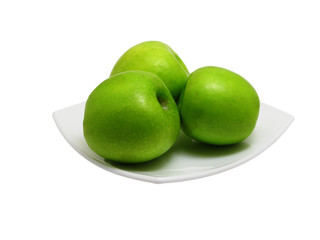 Green apples on square dish
