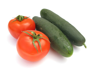 Cucumbers and tomatoes isolated on white background
