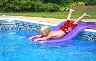 Little Boy Playing in the Pool