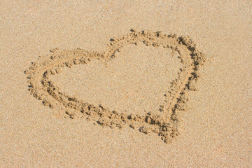 Heart drawn on sand