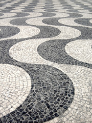 Detail of a typical portuguese cobblestone hand-made pavement